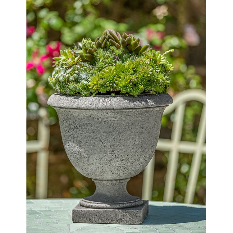 Tabletop concrete urn planted with succulent assortment