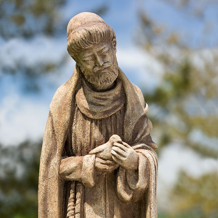 Close up of Saint Francis holding a bird
