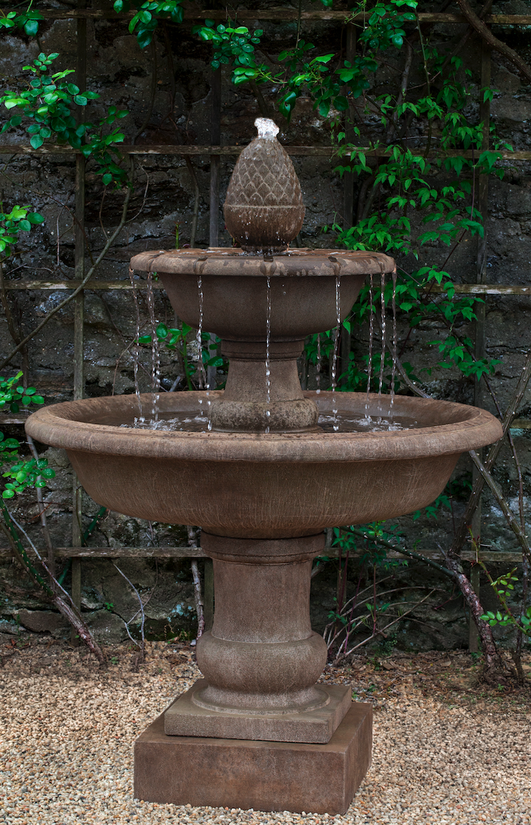 Brown tiered fountain with two round bowls on top of pedestal