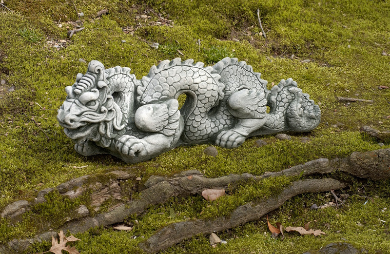 Dragon pictured on moss and wood bed