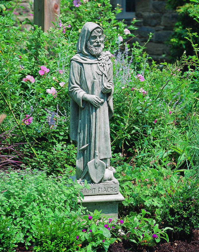 Saint Fiacre standing with a shovel on square plinth