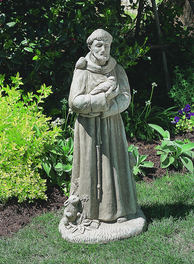 Saint Francis standing on small plinth and holding a bird