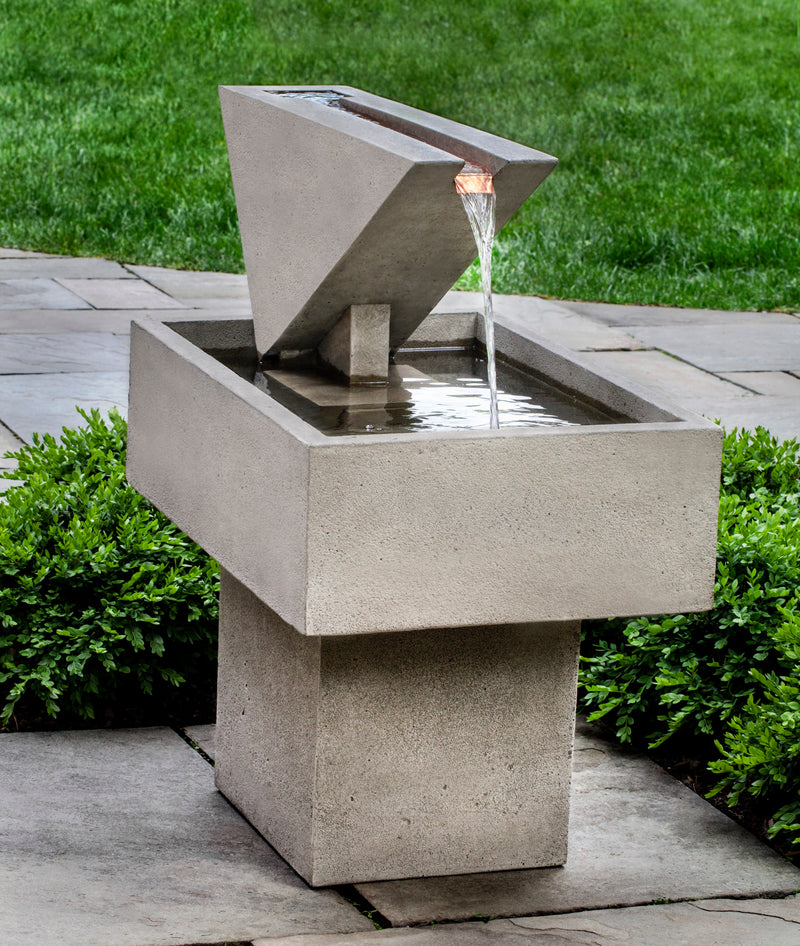 Contemporary fountain with square pedestal, rectangular basin and triangular top with copper spout