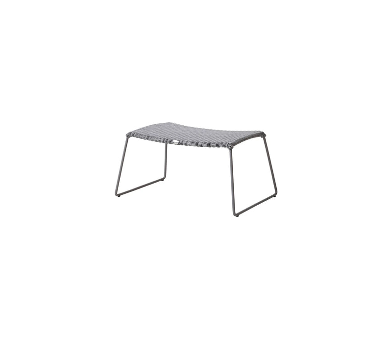 Gray woven outdoor footstool on white background