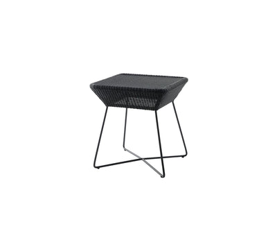 Black side table on white background