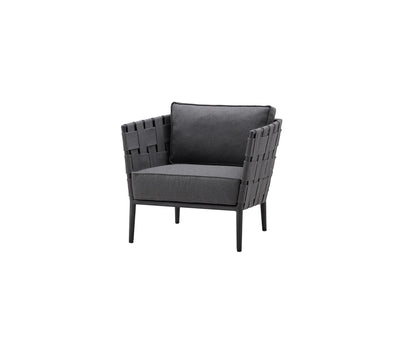 Outdoor black woven armchair with matching cushion on white background