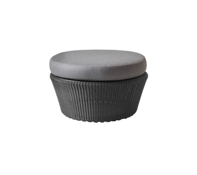 Black woven footstool with gray cushion