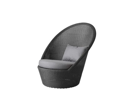 Dark gray armchair with cushions shown on white background