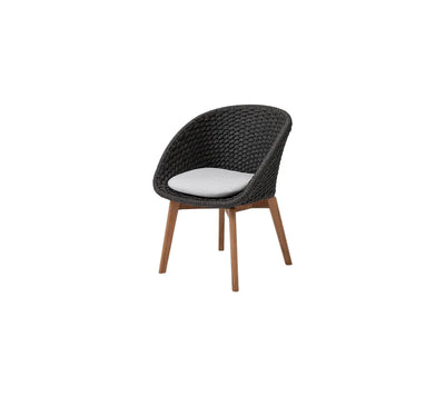 Black chair with white cushion on white background