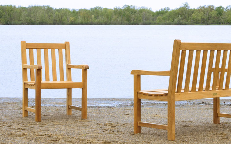 Teak bench and armchair shown on lake side