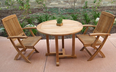 Teak bistro set with two chairs shown in front of perennial garden