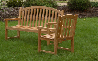 Teak bench and armchair shown on lawn
