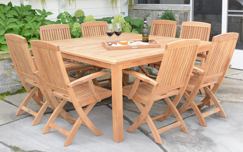 Teak table with eight matching chairs  shown on grey patio